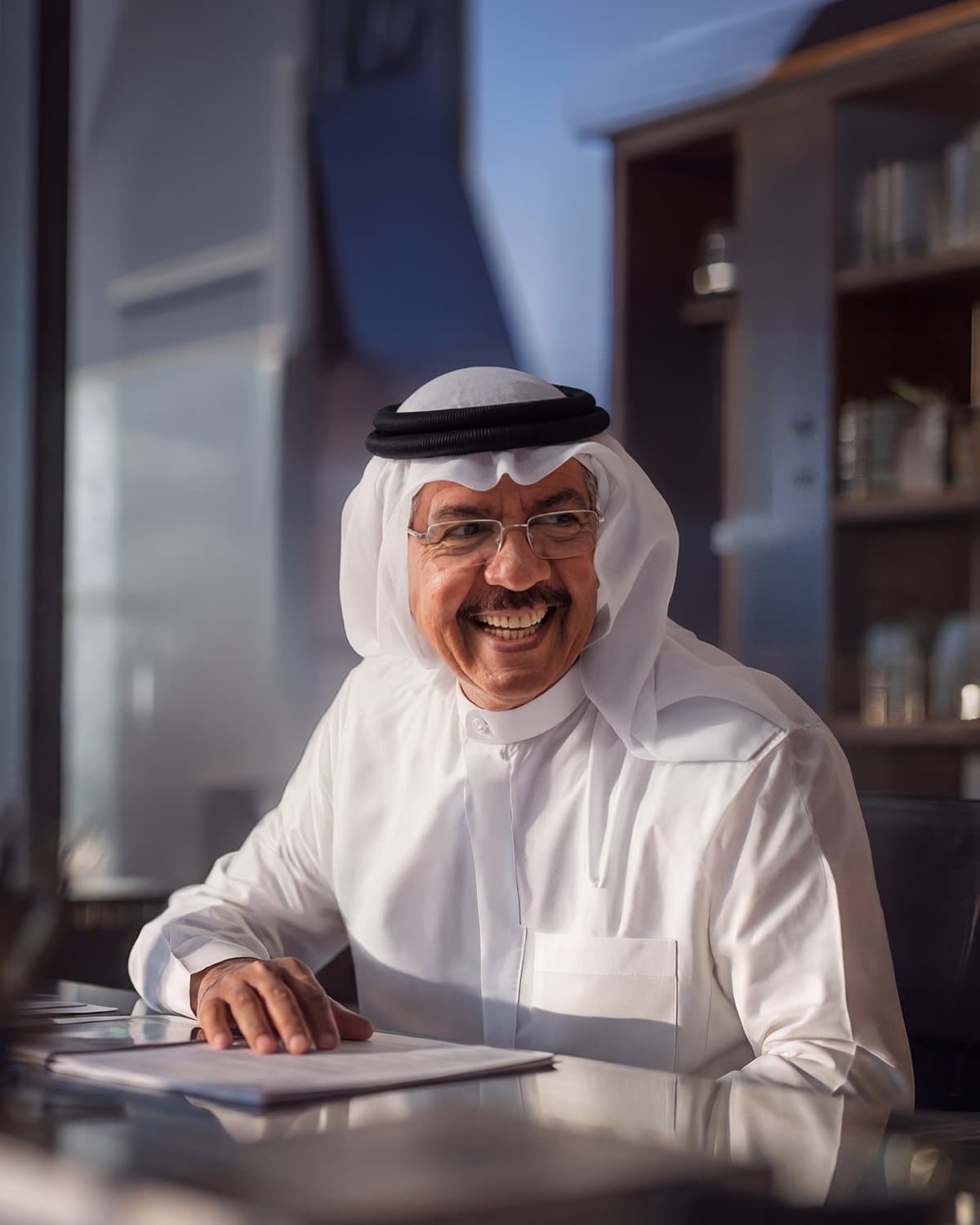 Khamis Al Muqla, founder of the Gulf Marcom Group, seated at his desk