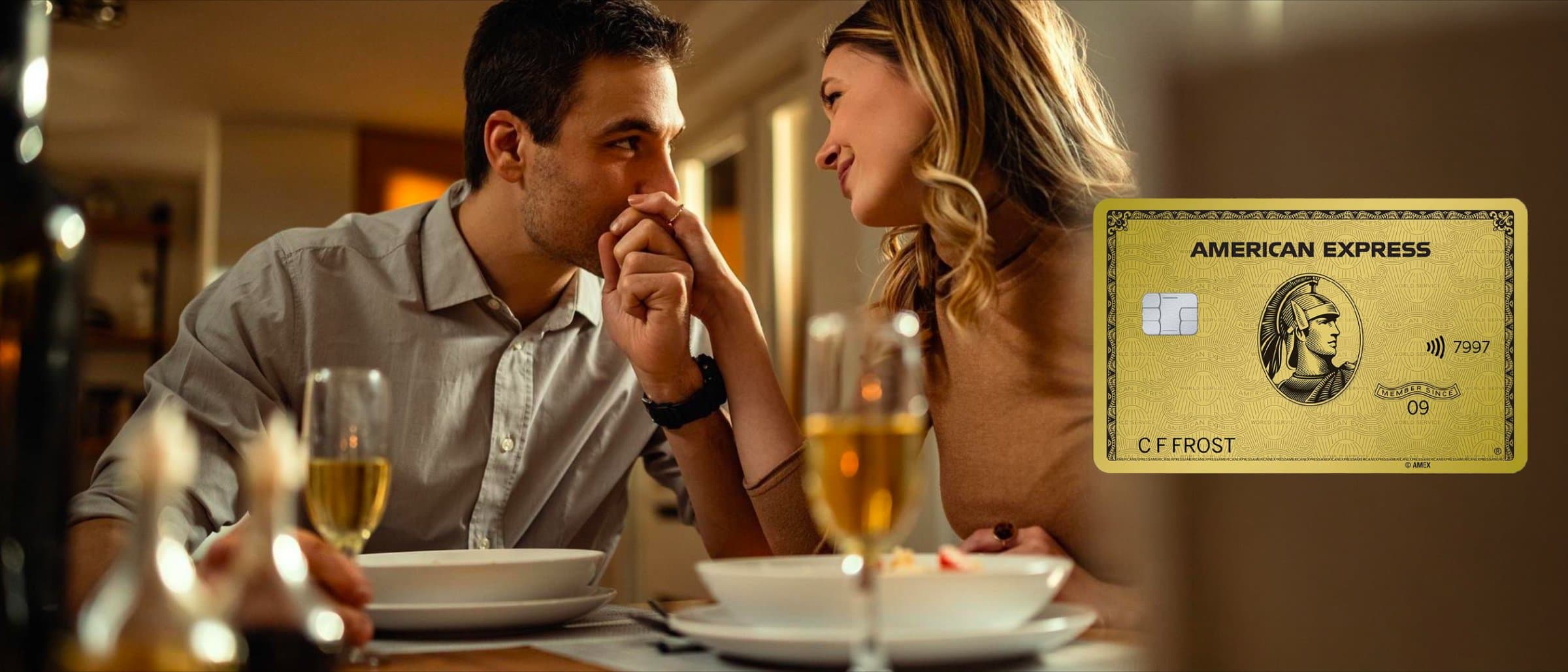 A couple dining at a restaurant, with an American Express Gold Card shown alongside